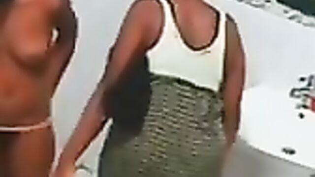 Эротичная негритянка в трусиках поглаживает соски